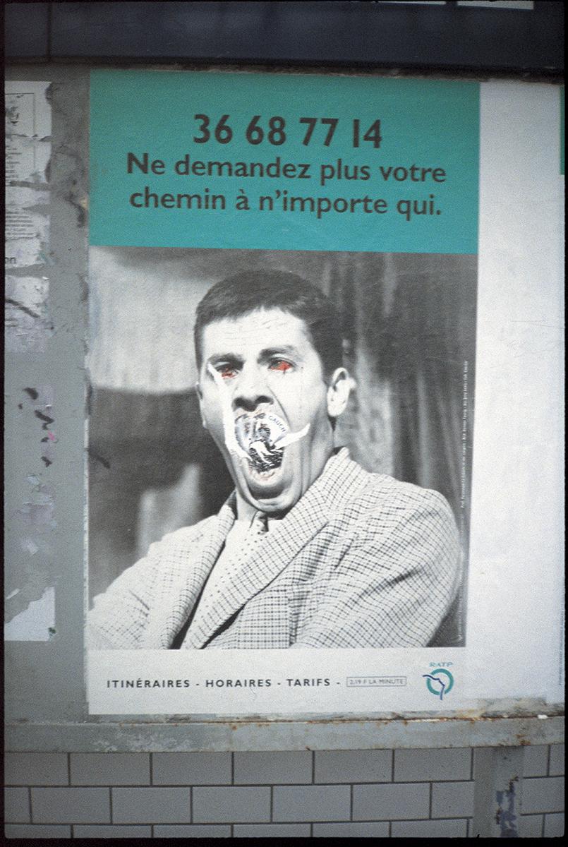Book cover of full bleed image of a poster with the text "36 68 77 14, Ne demandez plus votre chemin à n'importe qui." Under the text, there's an image of a man in a suit with his mouth open. The poster has been defaced by scratching the area around the man's mouth and colouring in his eyes red.